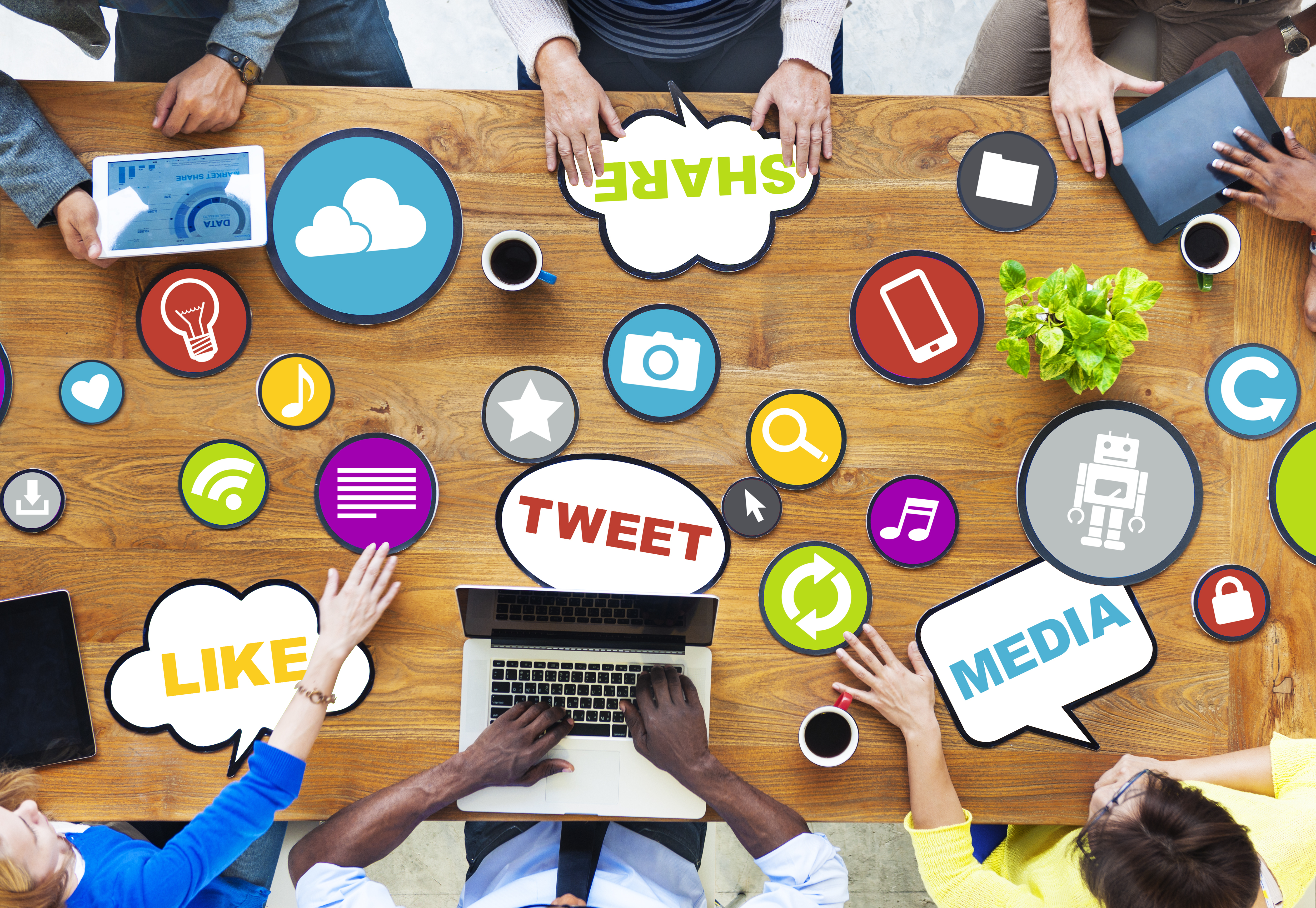 image of desk covered with stickers referencing social media 